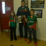 Eddie Doran (team player) with the Cup the  children of the school