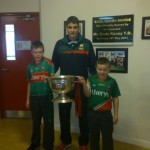 Eddie Doran (team player) with the Cup the  children of the school
